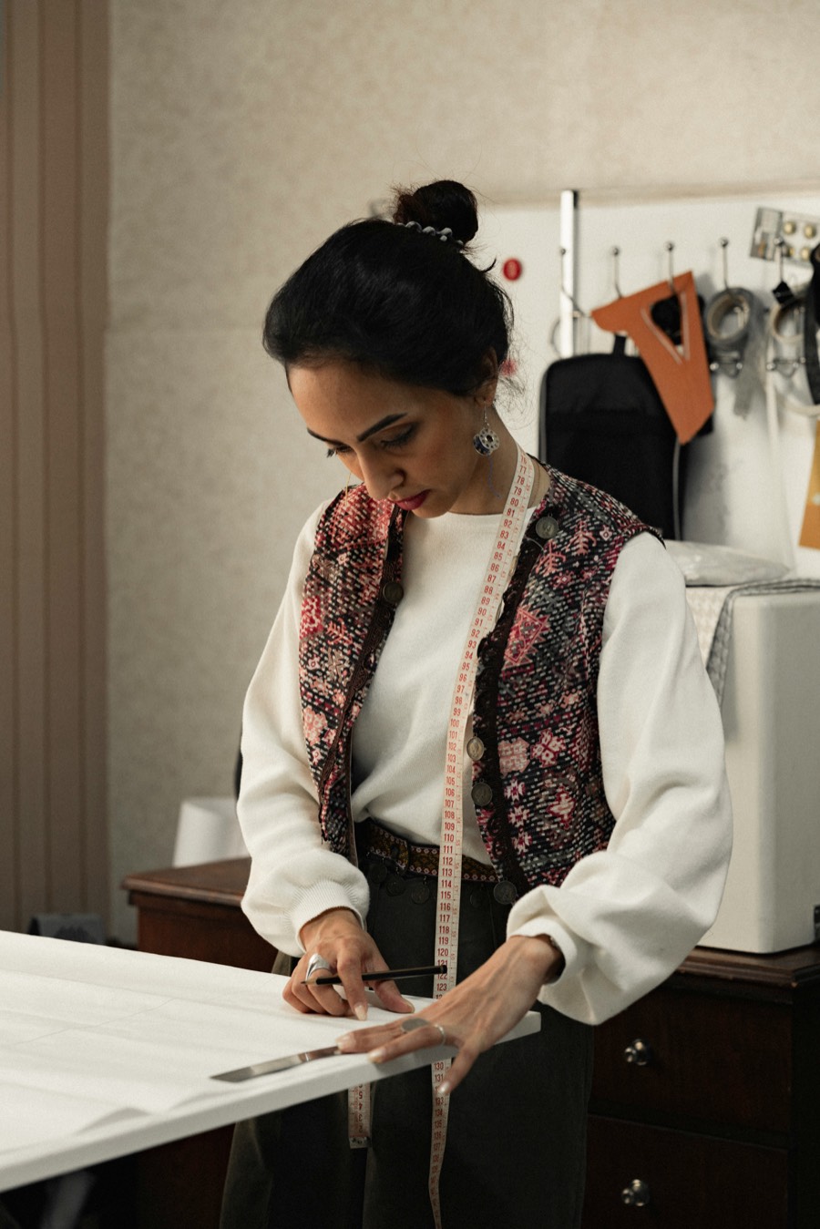 Tailor marking fabric on a cutting table